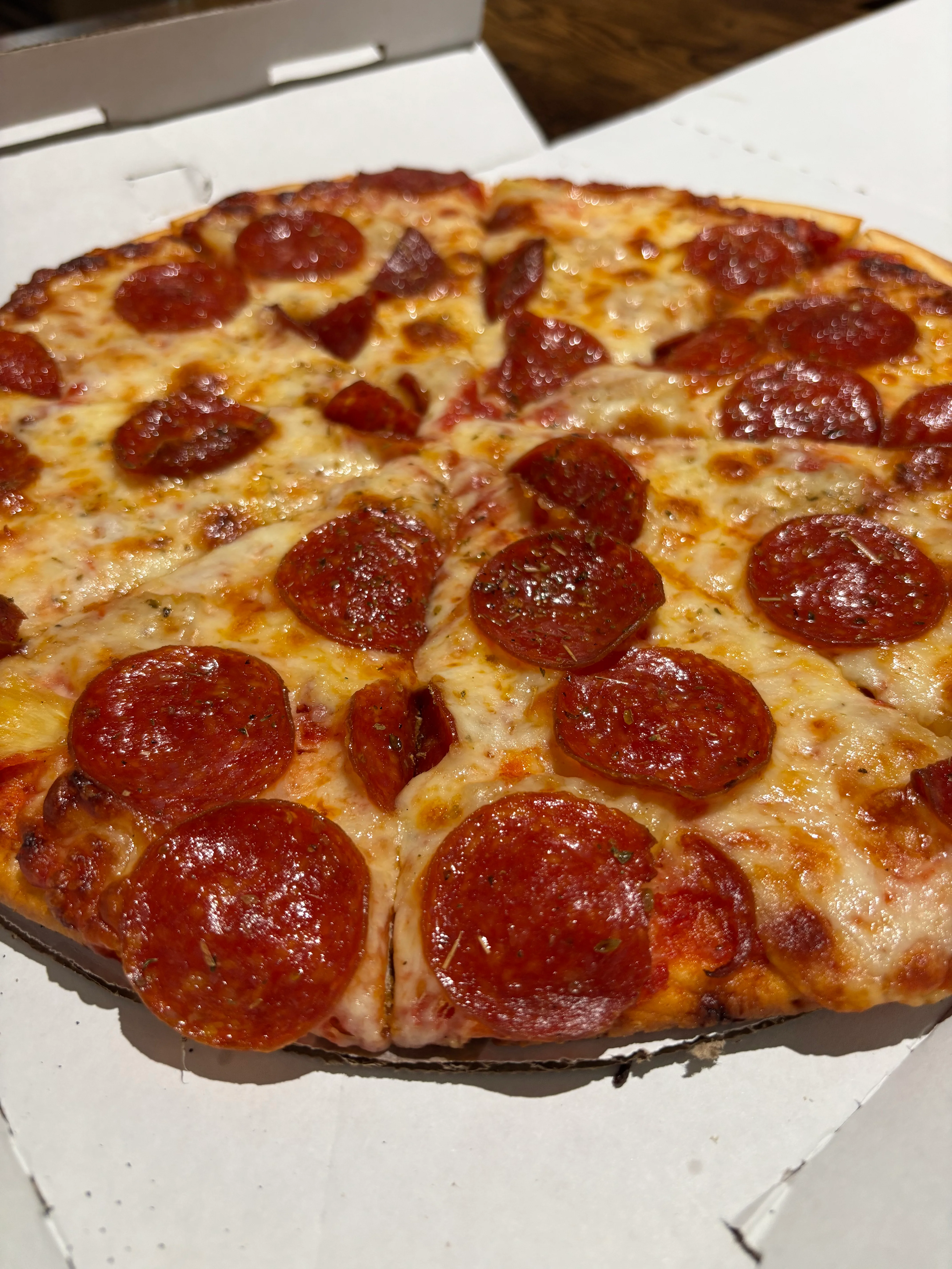 Pepperoni pizza served in a classic pizza box
