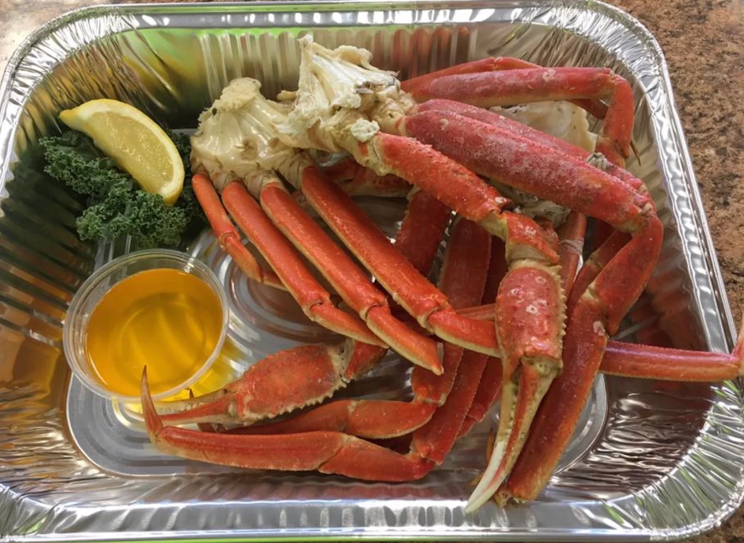 Steamed crab legs served with lemon and butter