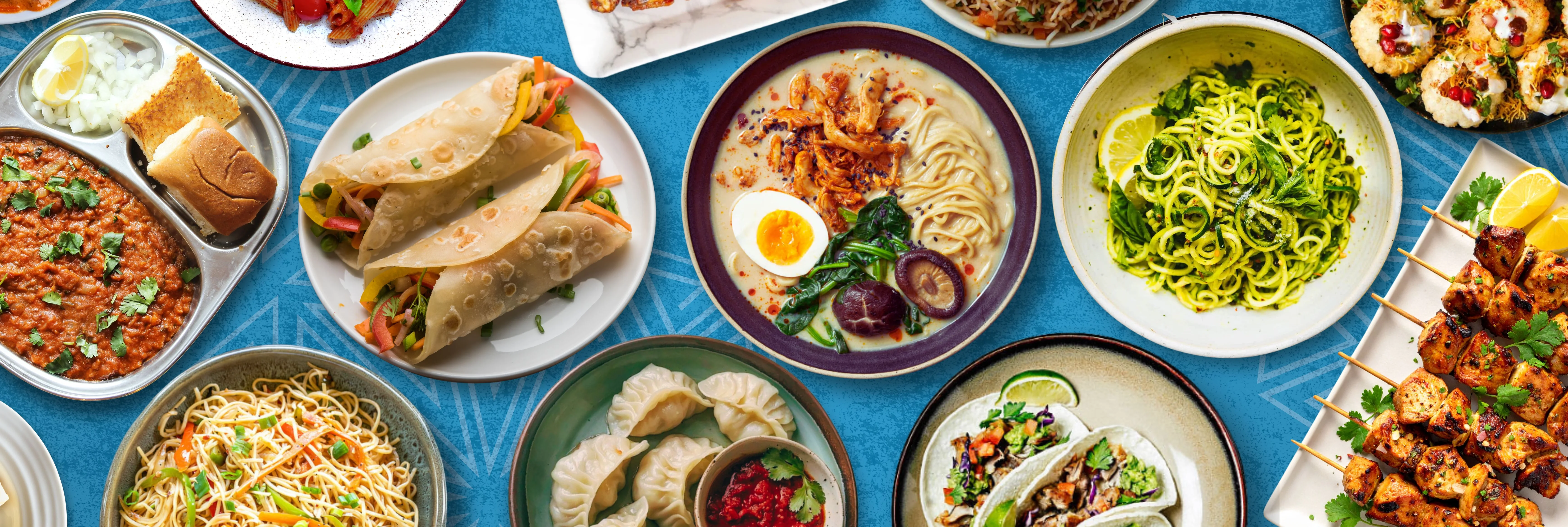 Assorted global dishes including pasta, dumplings, and tacos