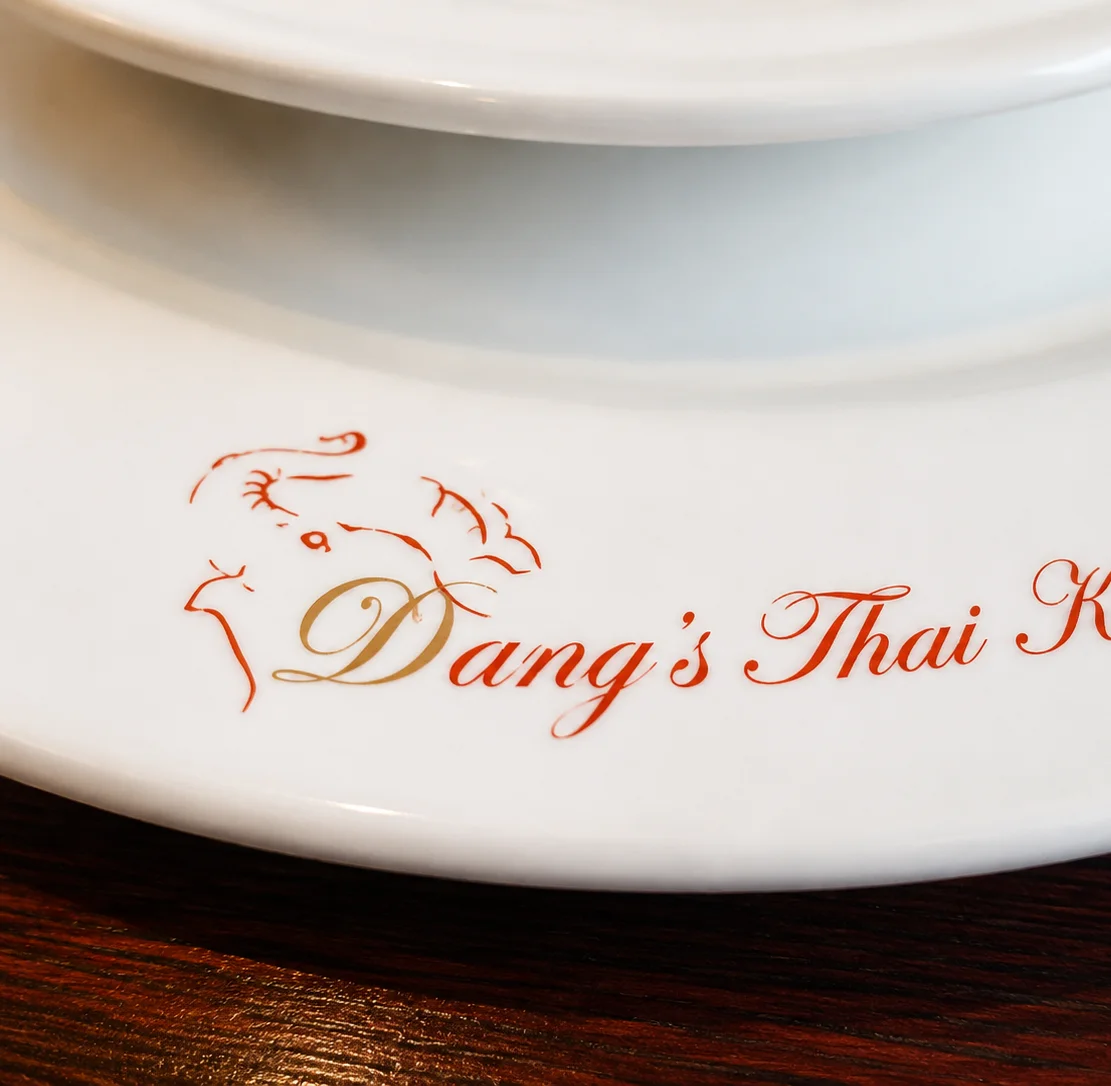 Logo of Dang's Thai Kitchen on a white plate