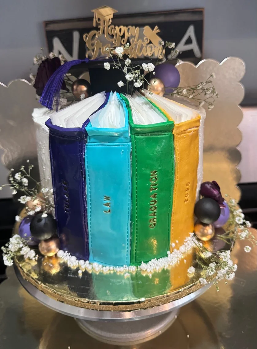 Colorful graduation cake designed as stacked books