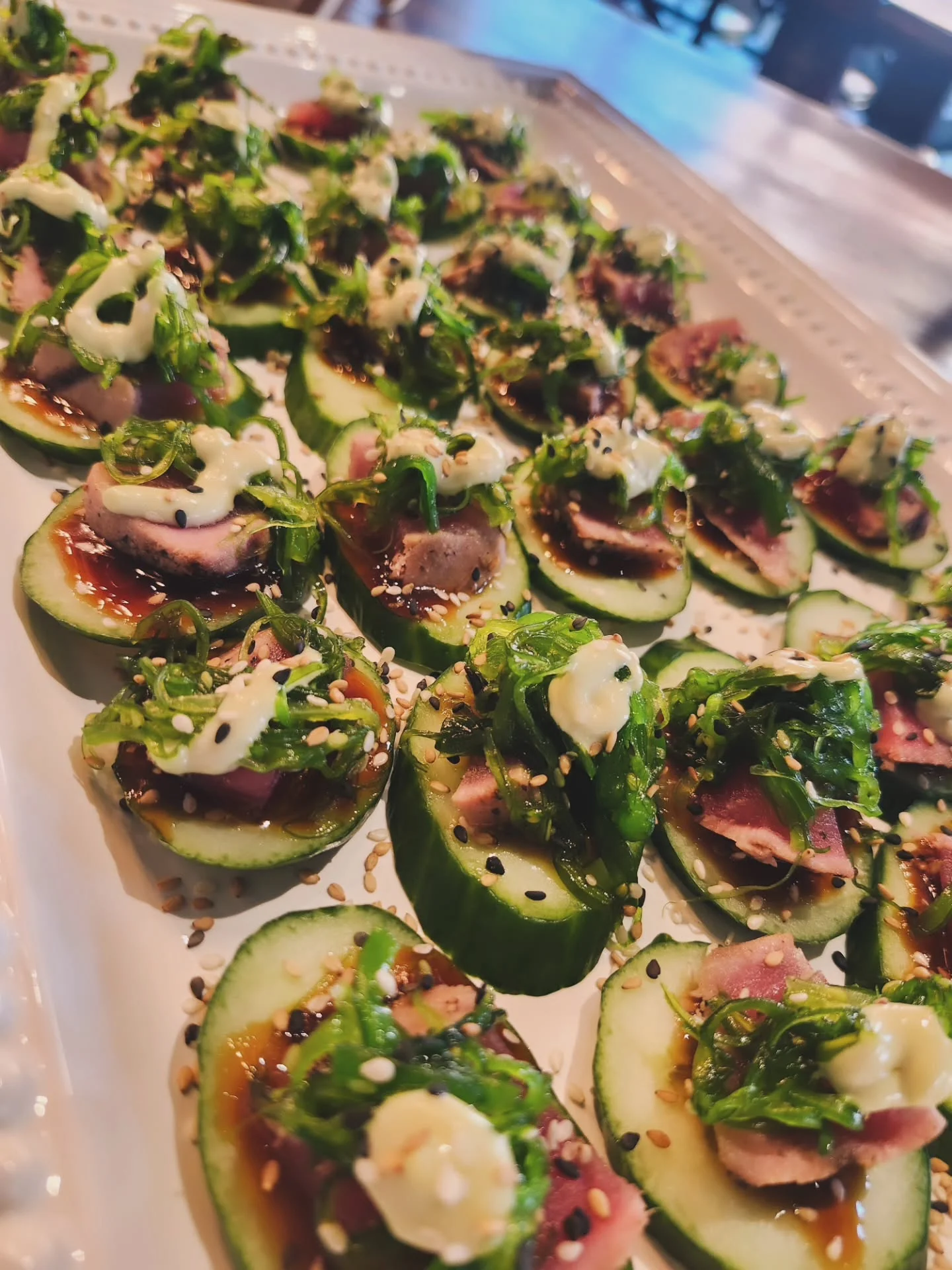 Japanese cucumber sushi bites with seafood and sauce