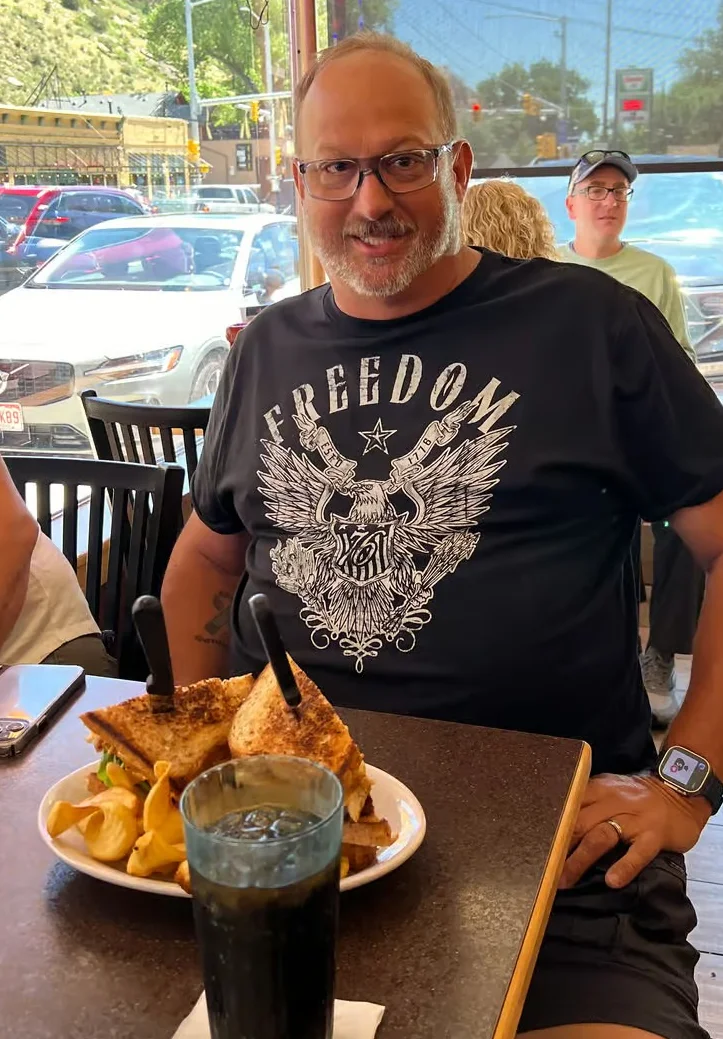 Grilled cheese sandwich with fries in a casual dining setting