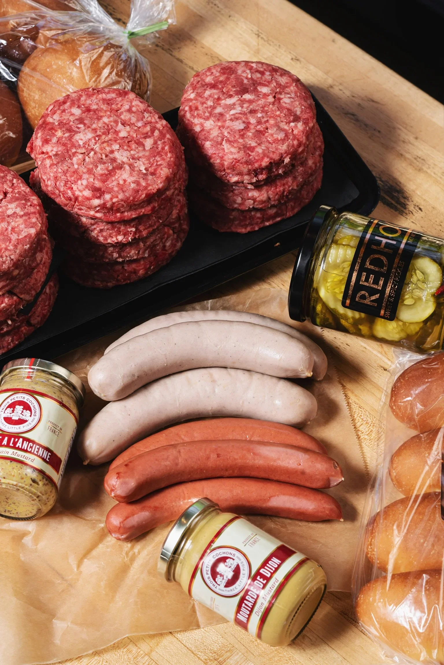 Delicious gourmet burger with fresh toppings on a wooden table
