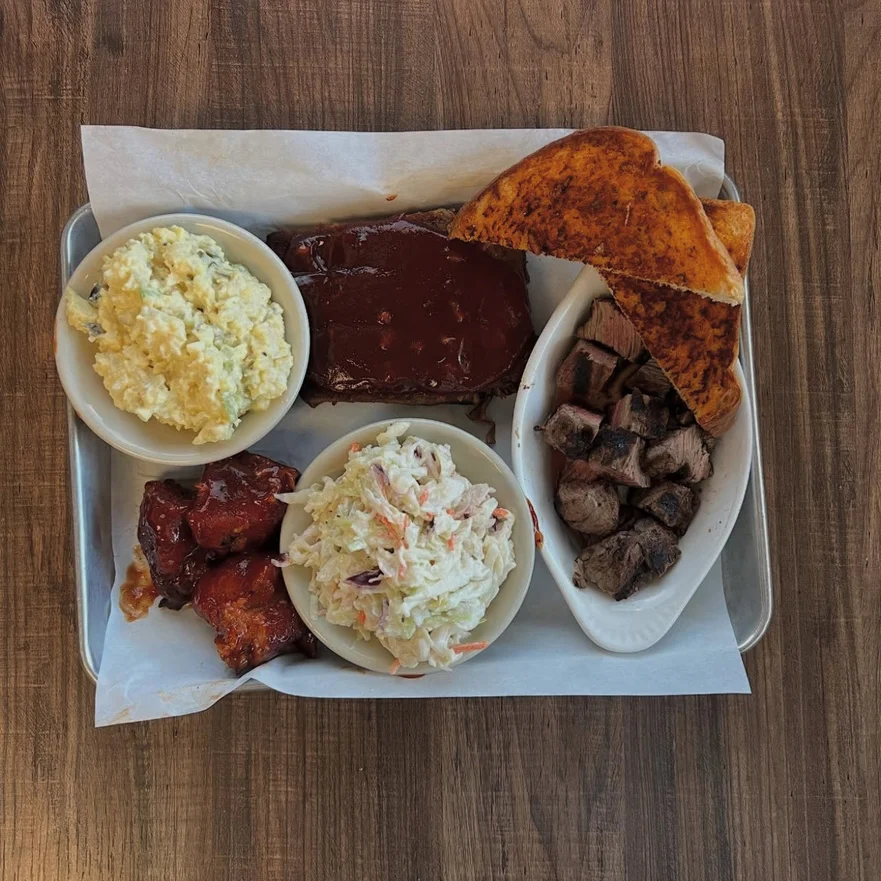 Southern barbecue platter with ribs and sides