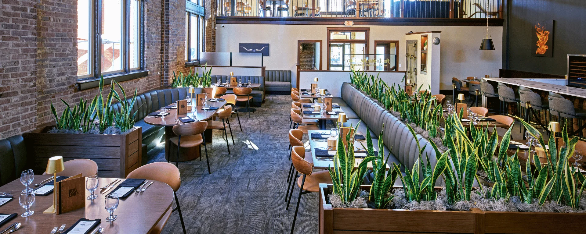 Stylish restaurant interior with modern decor and greenery