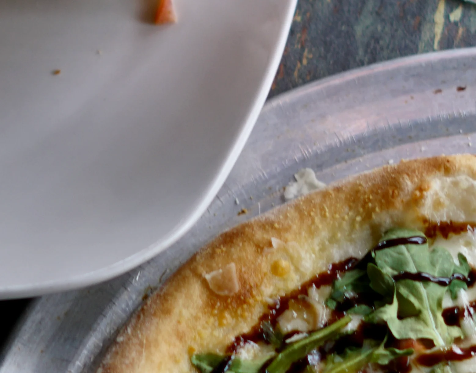Gourmet pizza with arugula and balsamic glaze