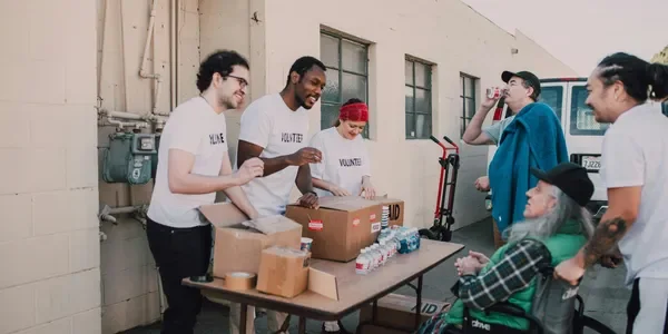 Volunteers serving food at a community event