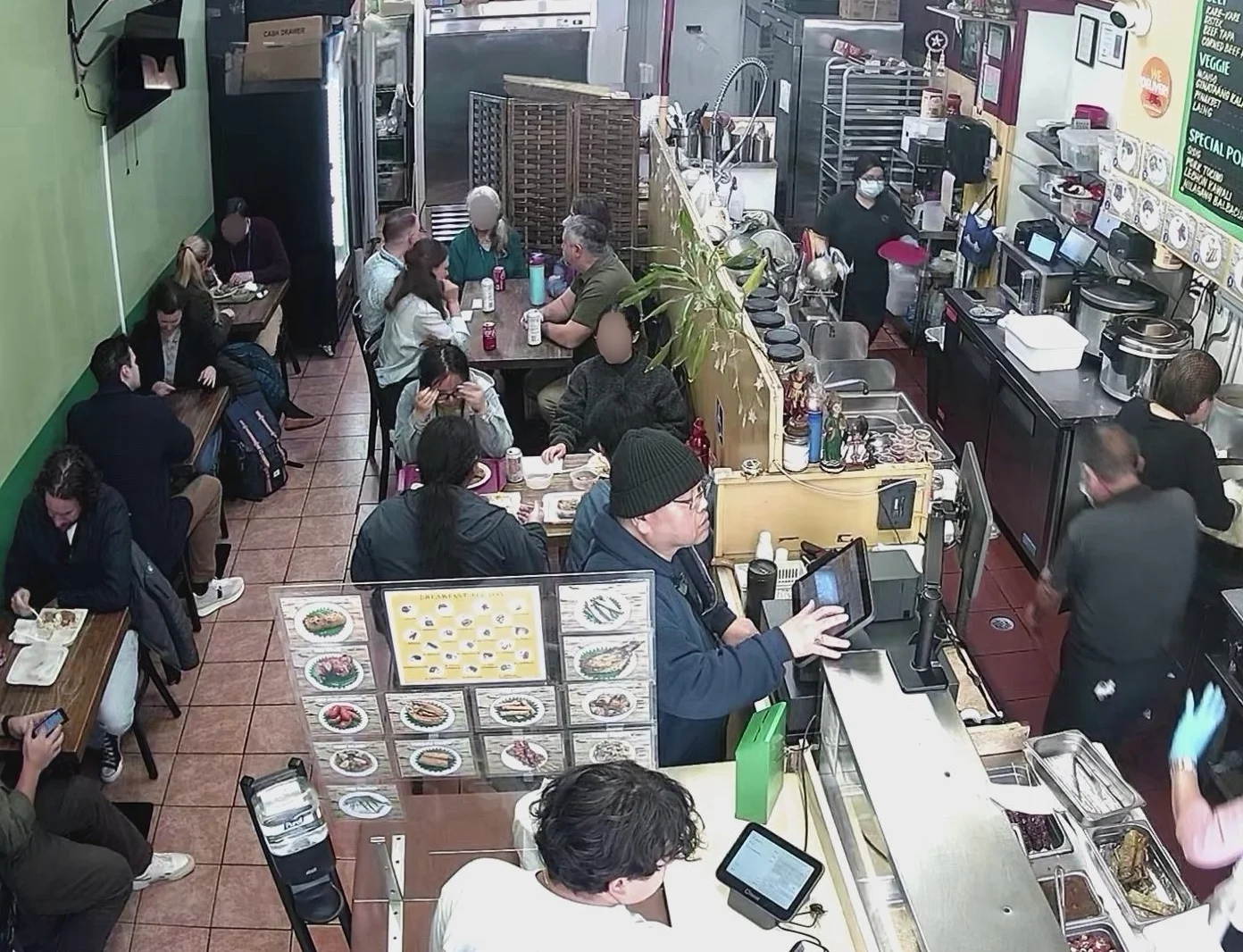 Busy restaurant interior with diners enjoying meals