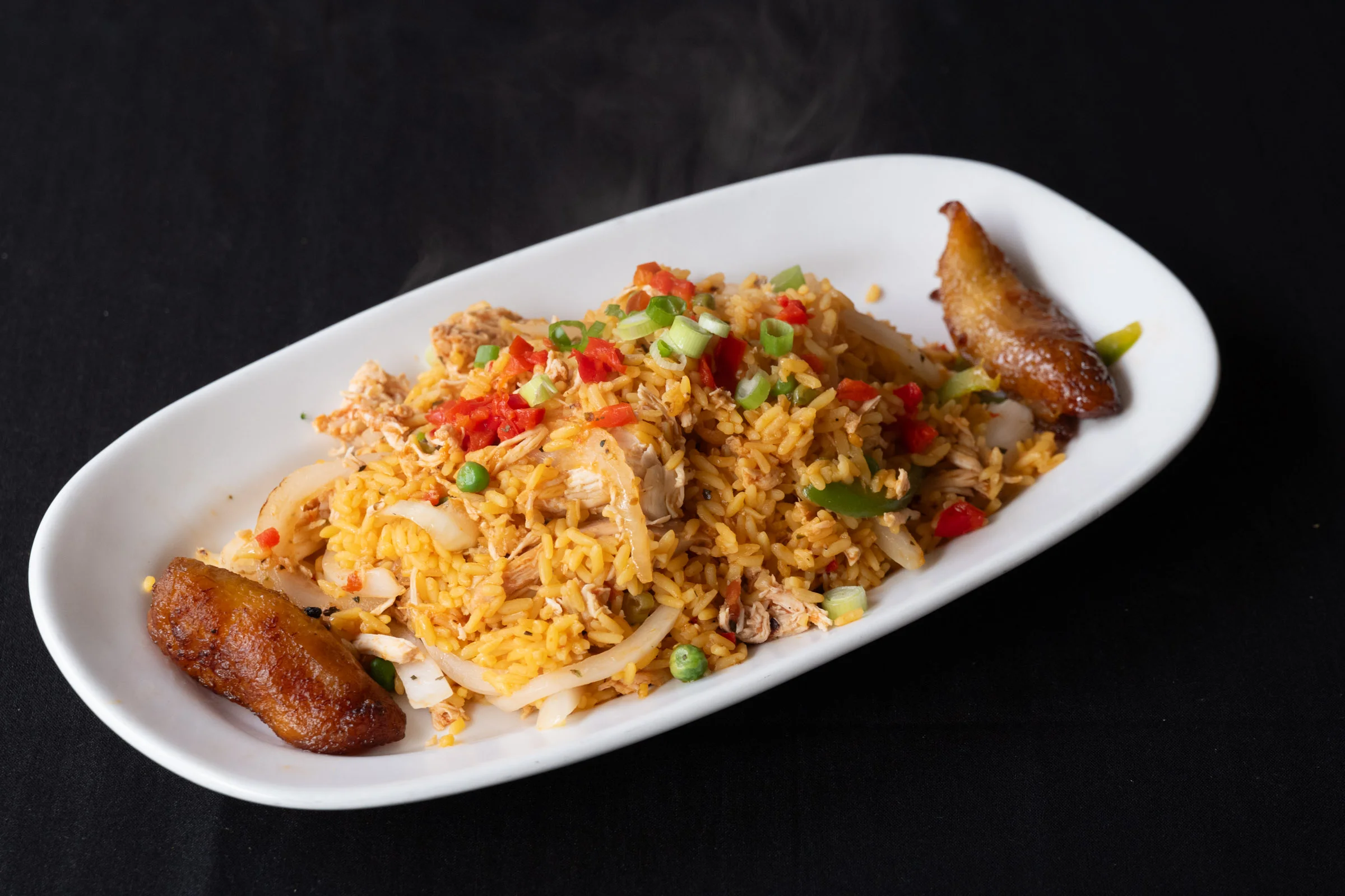 Nigerian jollof rice with chicken and plantains