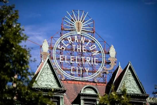 Historic Electric City sign against blue sky