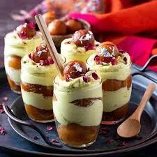 Indian dessert glass with gulab jamun and saffron mousse