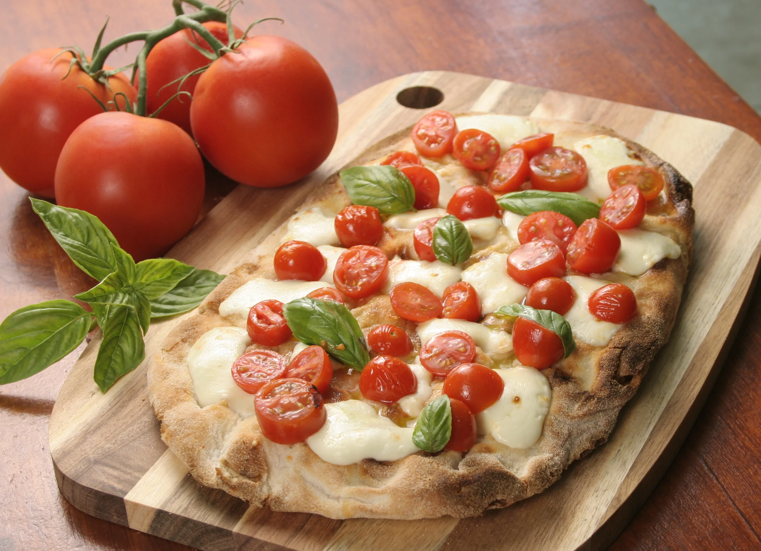 Bufalina Pinsa Romana served with Bufalo's mozzarella, cherry tomatoes, fresh basil at Daje Pinsa Roman Pizza, Orlando.