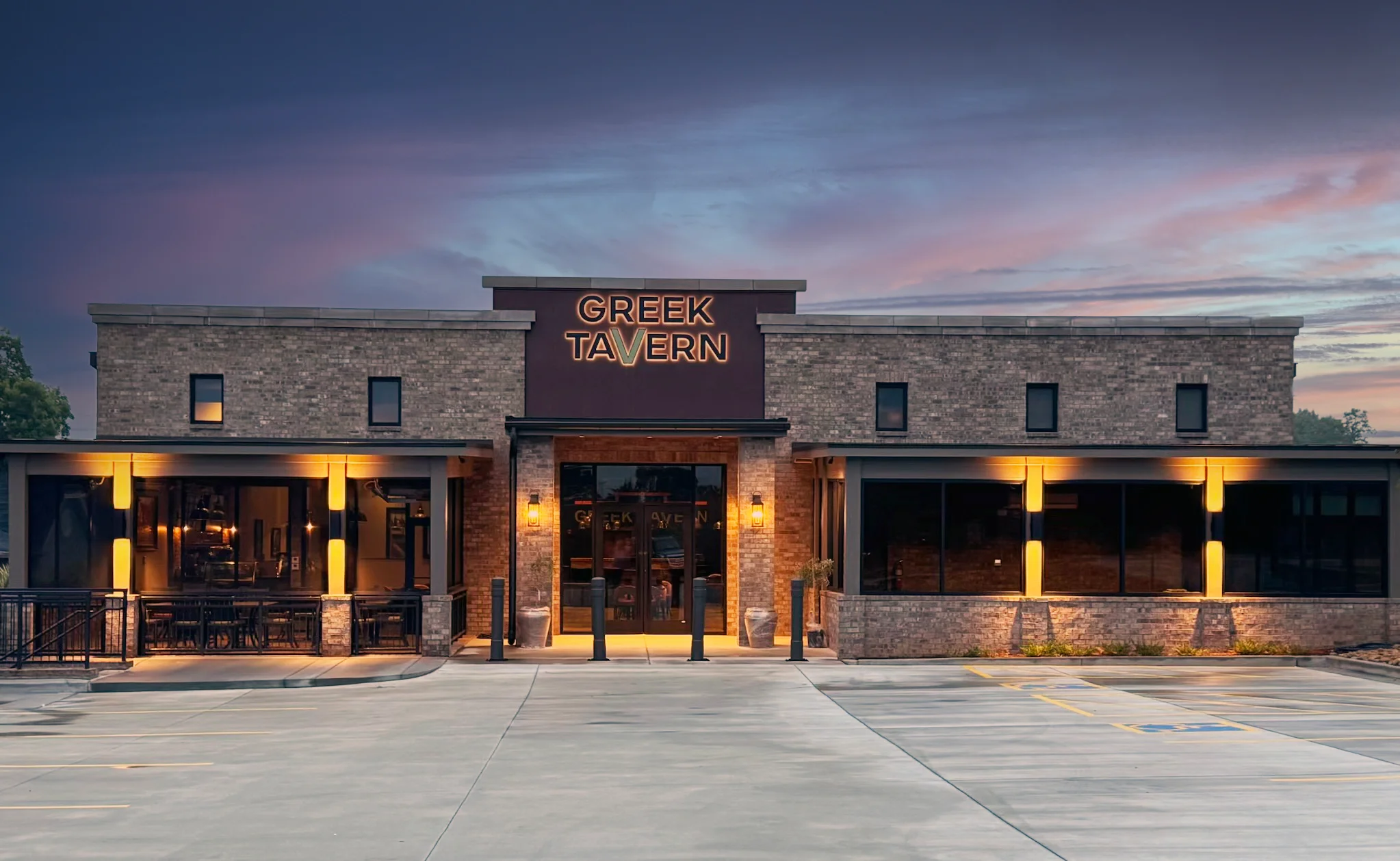 Exterior view of Greek Tavern restaurant at dusk