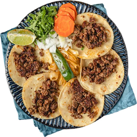 Authentic Mexican tacos al pastor with fresh toppings