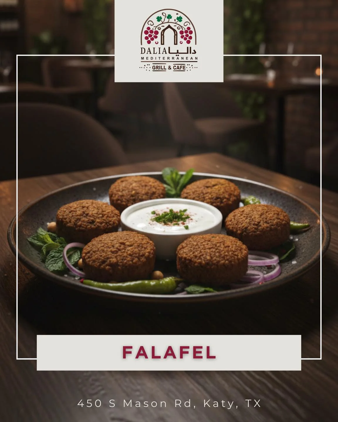A plate of falafel served with a creamy dipping sauce, garnished with mint and surrounded by green chilies and onion slices.