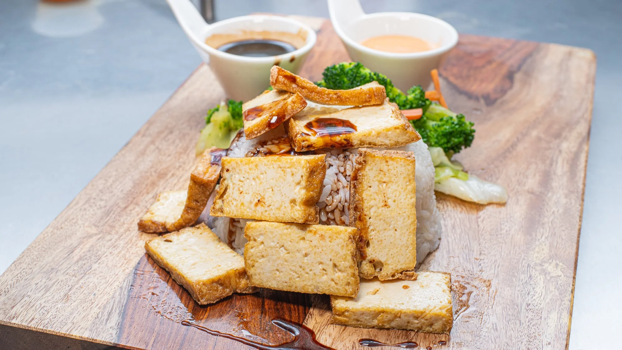 Vegetarian Thai tofu rice bowl with steamed vegetables