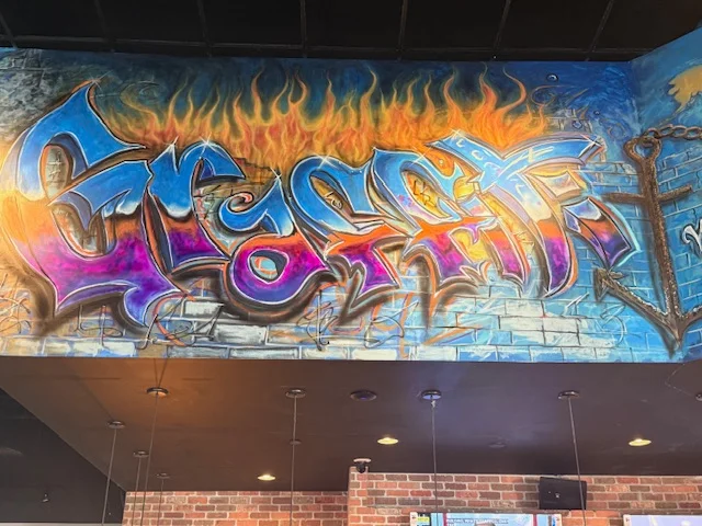 Vibrant graffiti mural in a restaurant interior