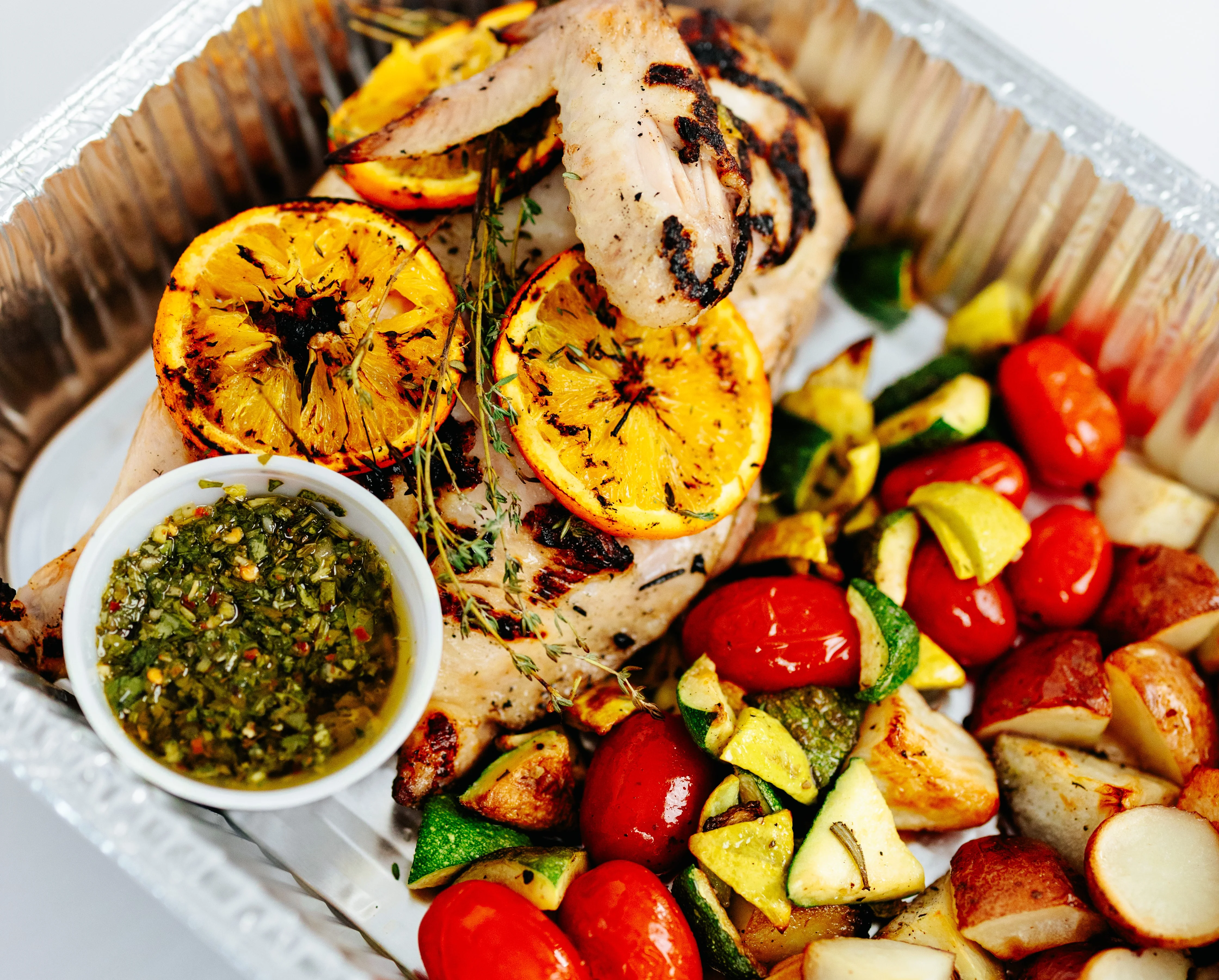 Grilled lemon herb chicken with roasted vegetables