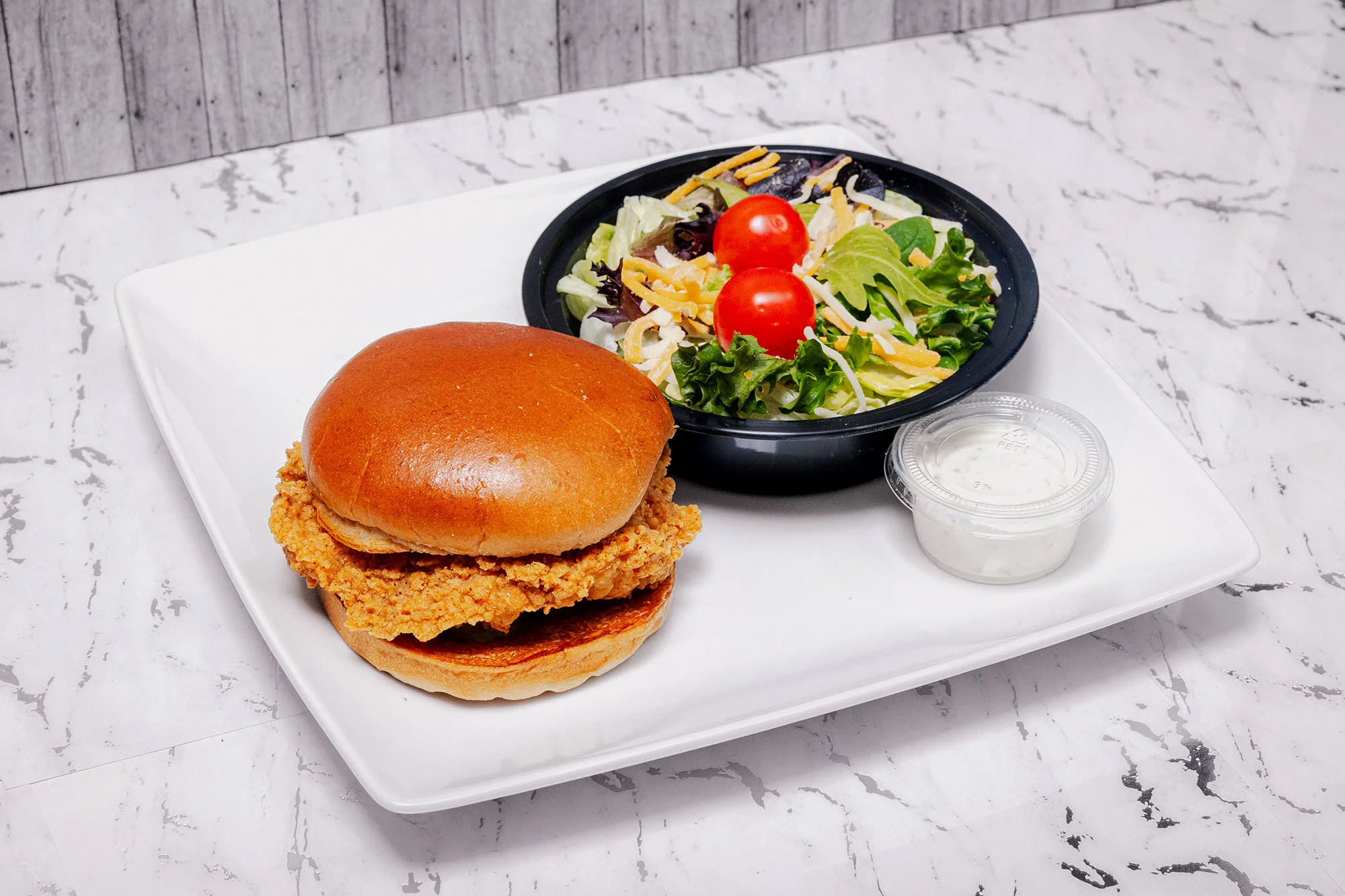 Chicken sandwich and side salad