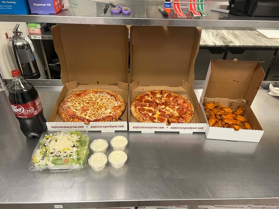 Family Feast ( 2 Large 1 topping pizzas, 20 wings, Large garden salad & a 2 liter)