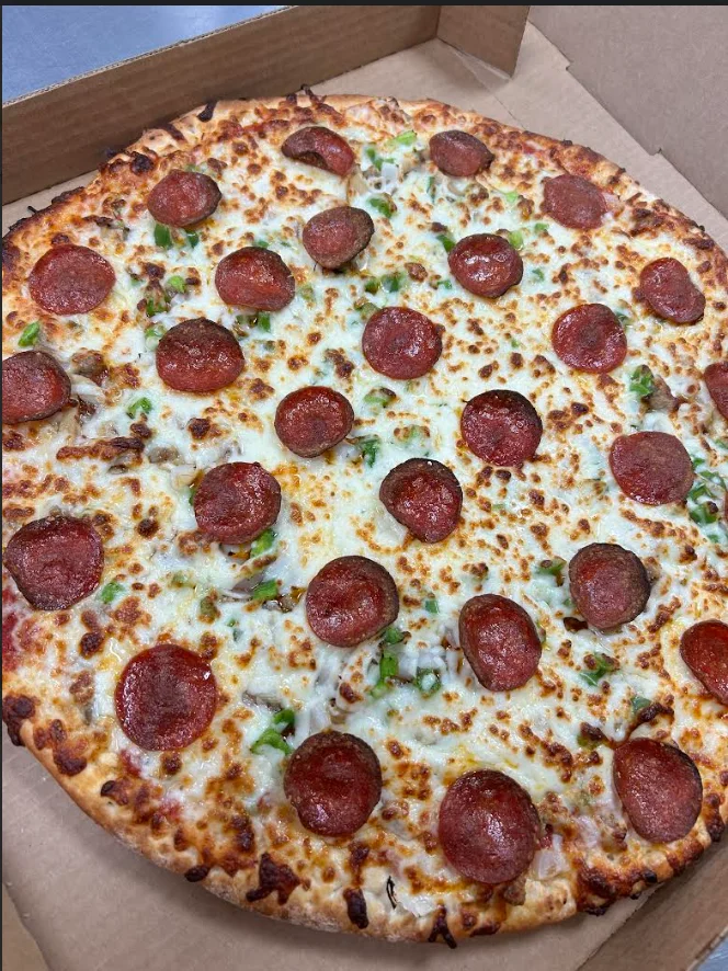 Pepperoni pizza with green peppers and melted mozzarella