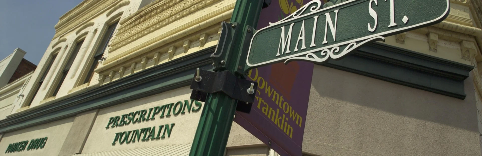 Historic building on Main Street with a pharmacy sign