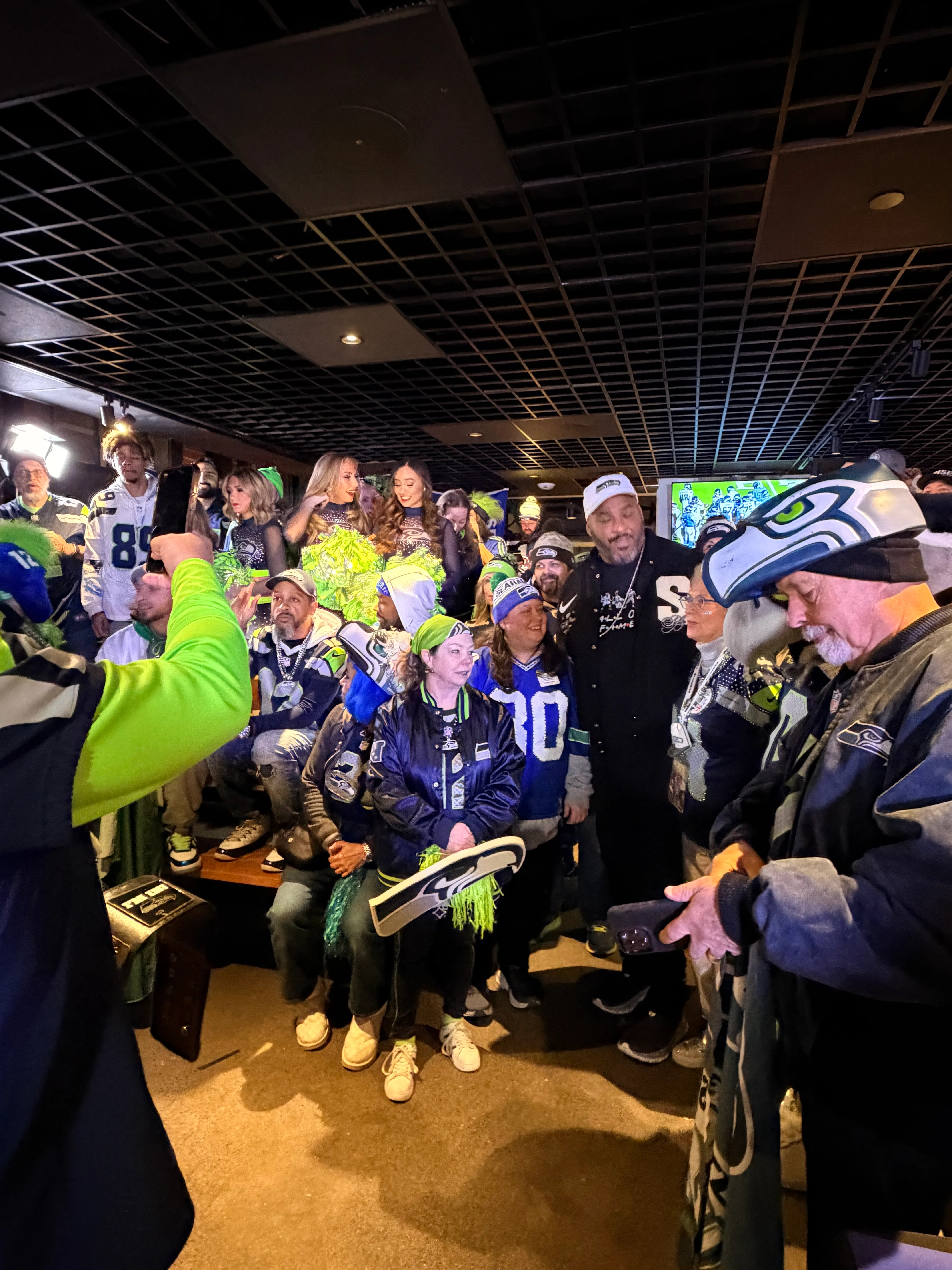 Excited fans celebrating at a sports bar during game day