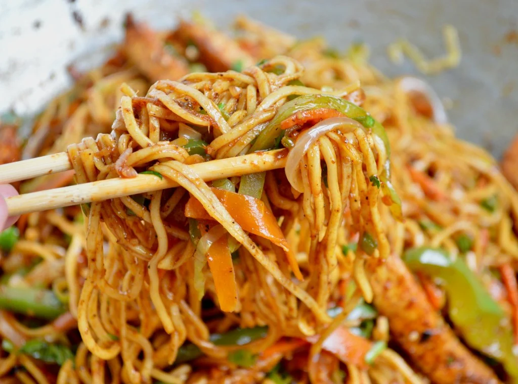 Delicious plate of Chinese chow mein with colorful vegetables