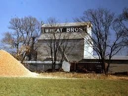Historic grain elevator with Wheat Bros sign