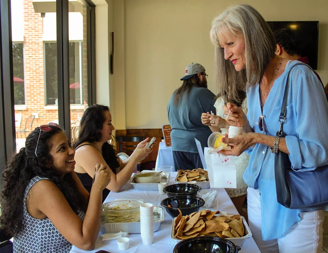 Guests enjoying a casual dining experience with snacks and conversation