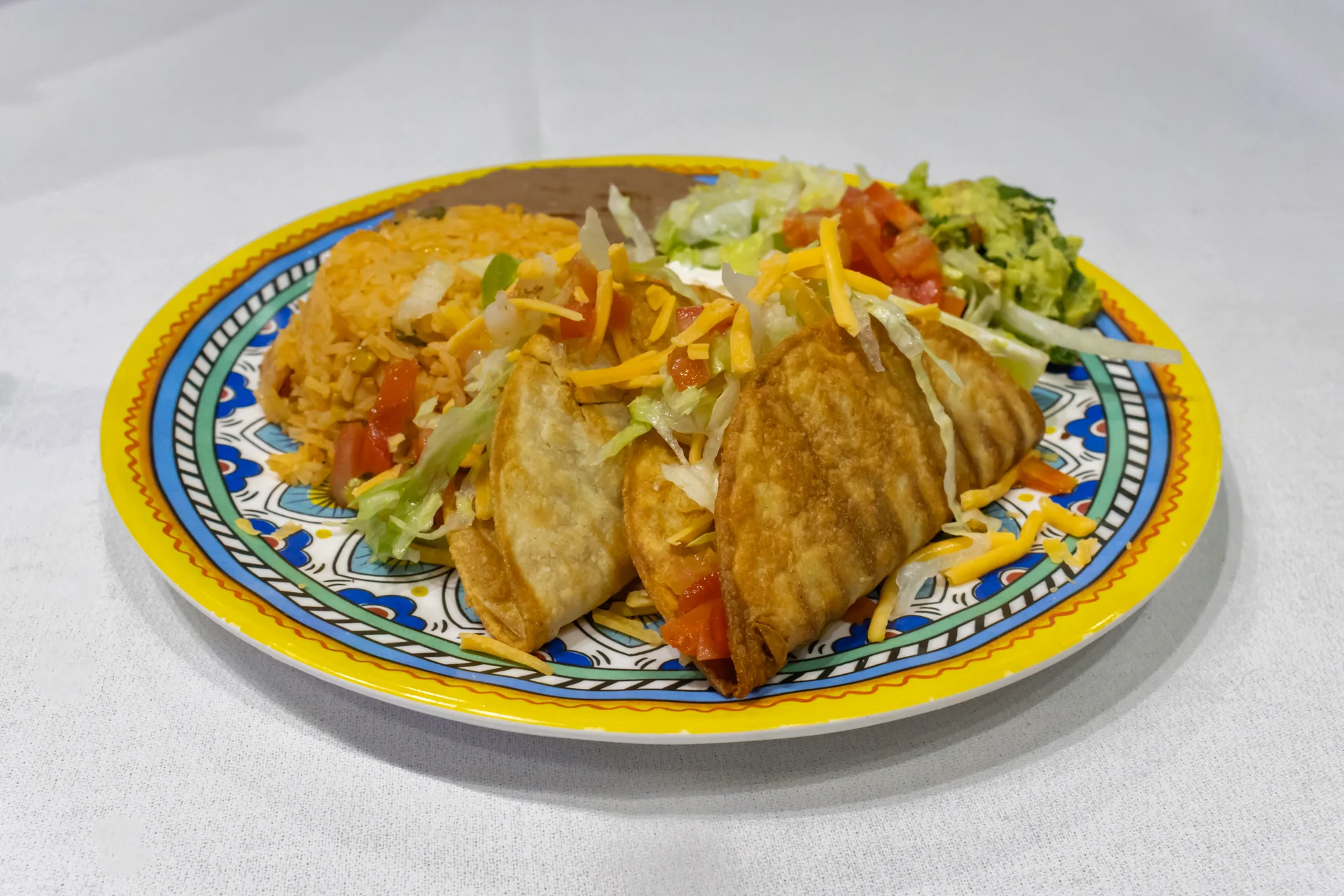 Crispy Mexican tacos with rice and fresh toppings