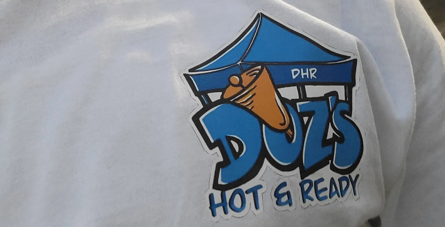 Doz DHR merchandies on a blank white tee.