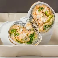 Sushi burrito filled with fresh ingredients