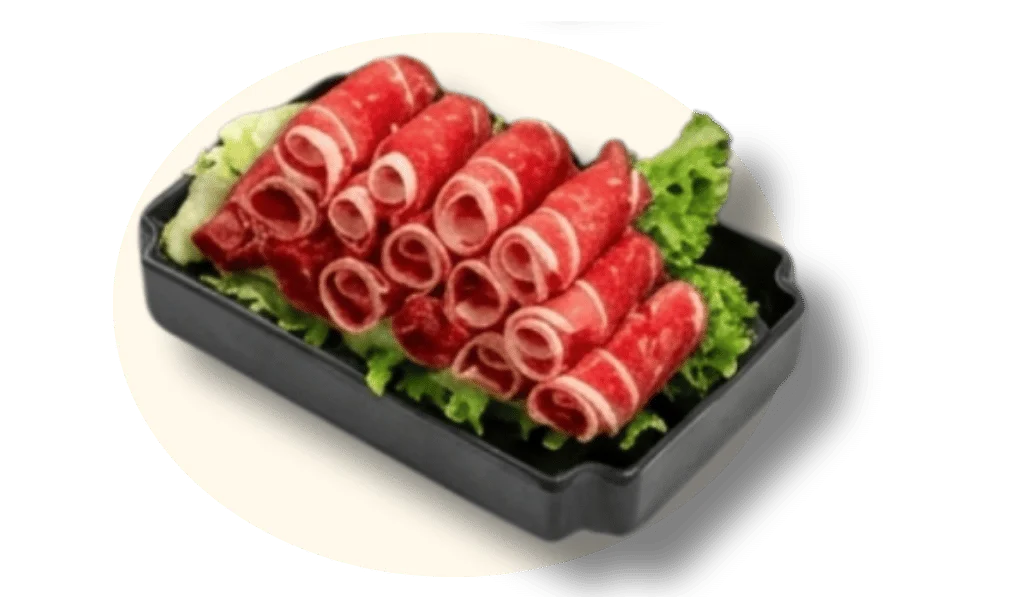 Thinly sliced beef on a bed of lettuce in a black tray.