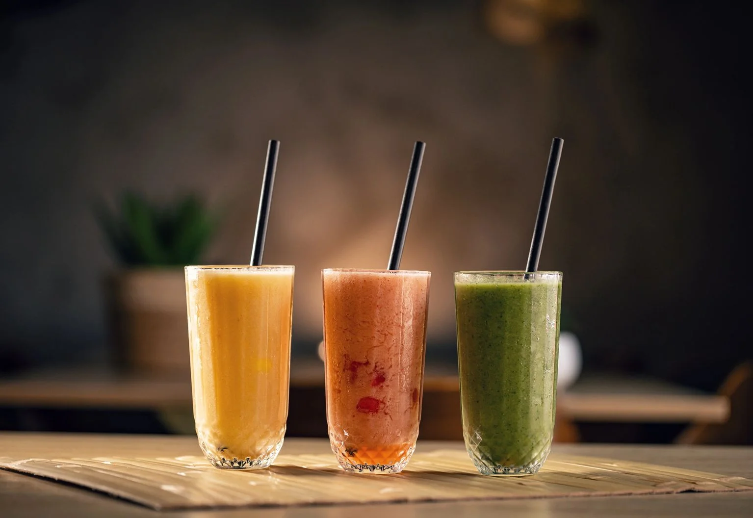 Refreshing smoothies in vibrant colors served in tall glasses