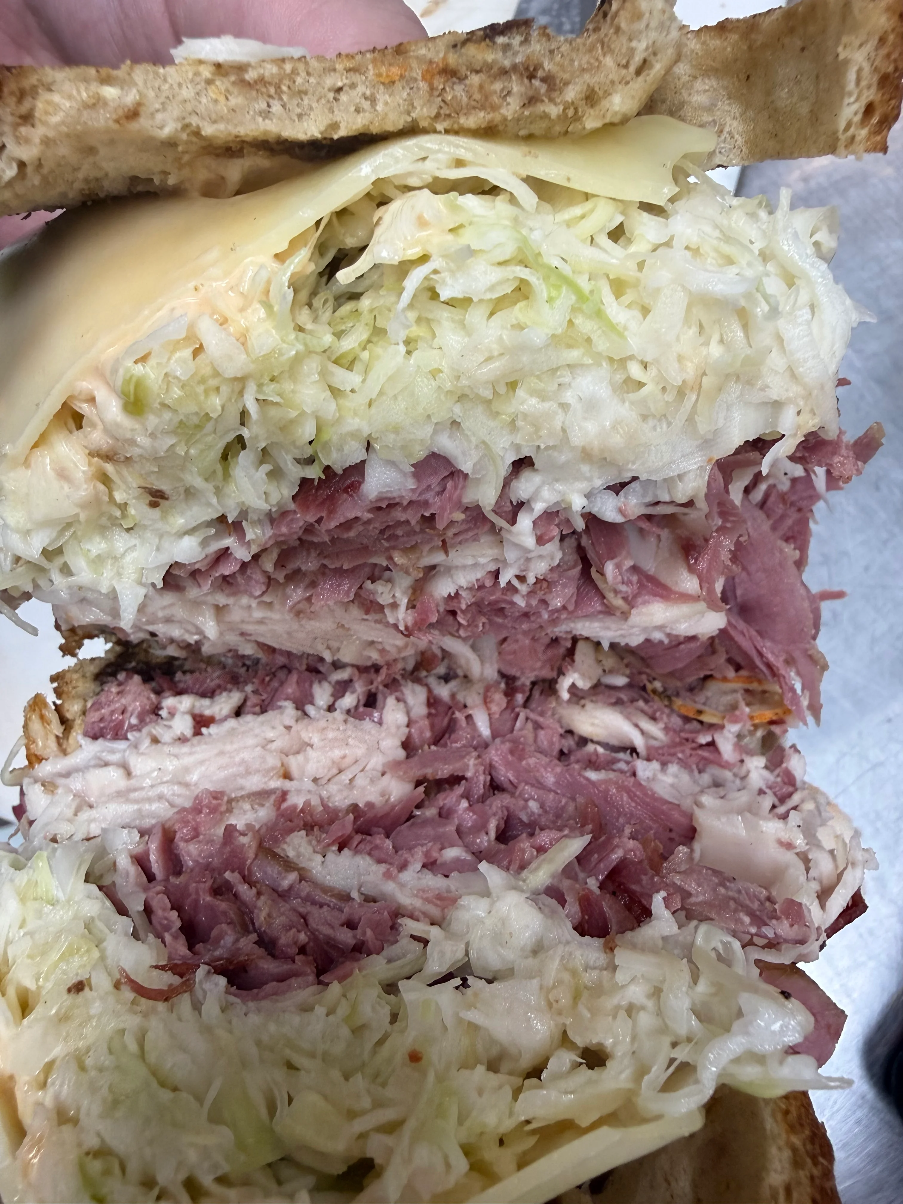 Delicious corned beef served on a plate with garnishes.