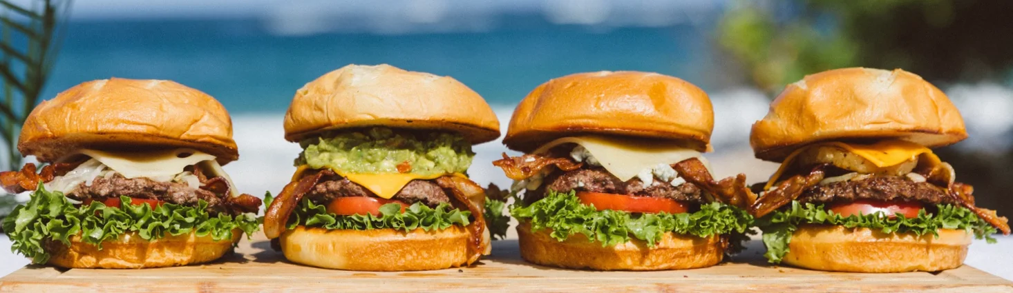 Gourmet burgers on a beachside table