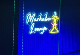 Neon sign of Marhaba Lounge with vibrant colors