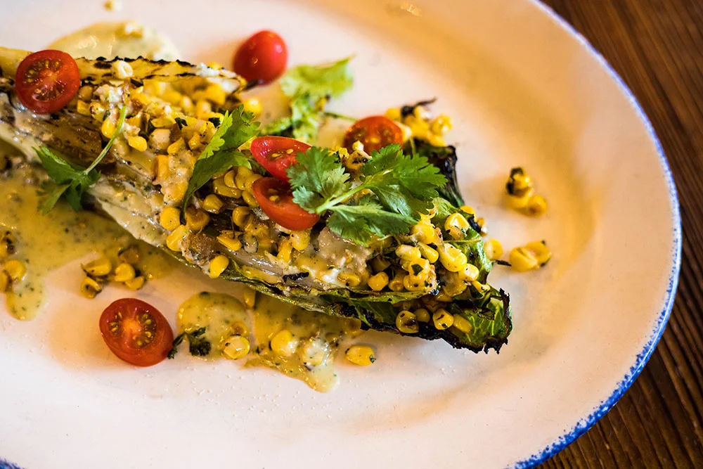 Grilled Mexican street corn salad on romaine