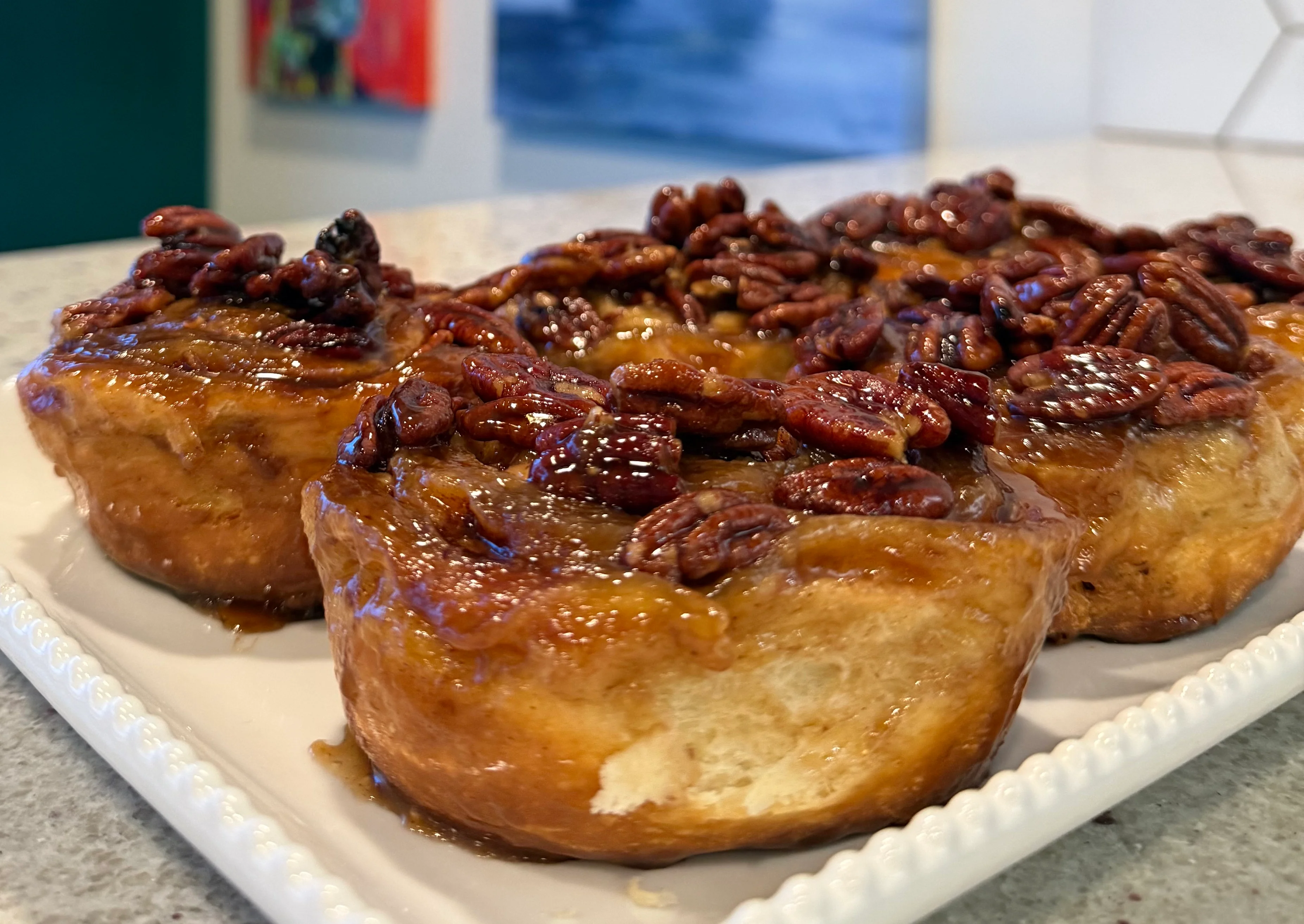 Pecan sticky buns on a decorative plate