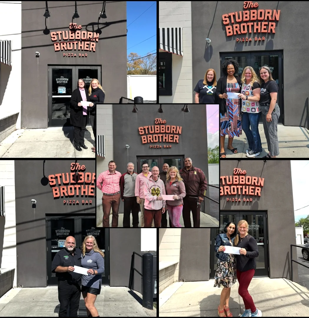 Exterior of The Stubborn Brother Pizza Bar with patrons outside