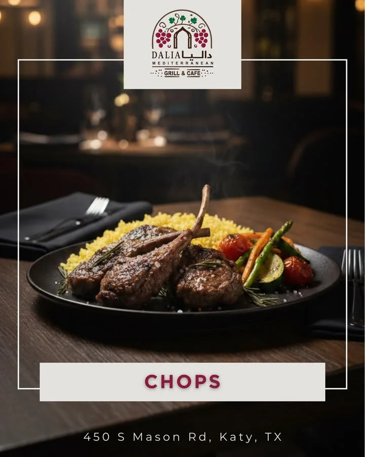 A plate of lamb chops accompanied by yellow rice and grilled vegetables, creating a rich and savory dish.