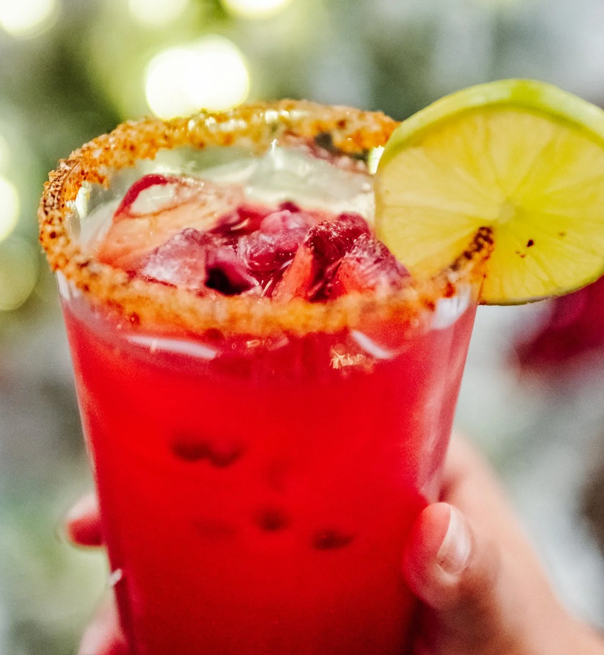 Vibrant Mexican cocktail with lime and chili rim