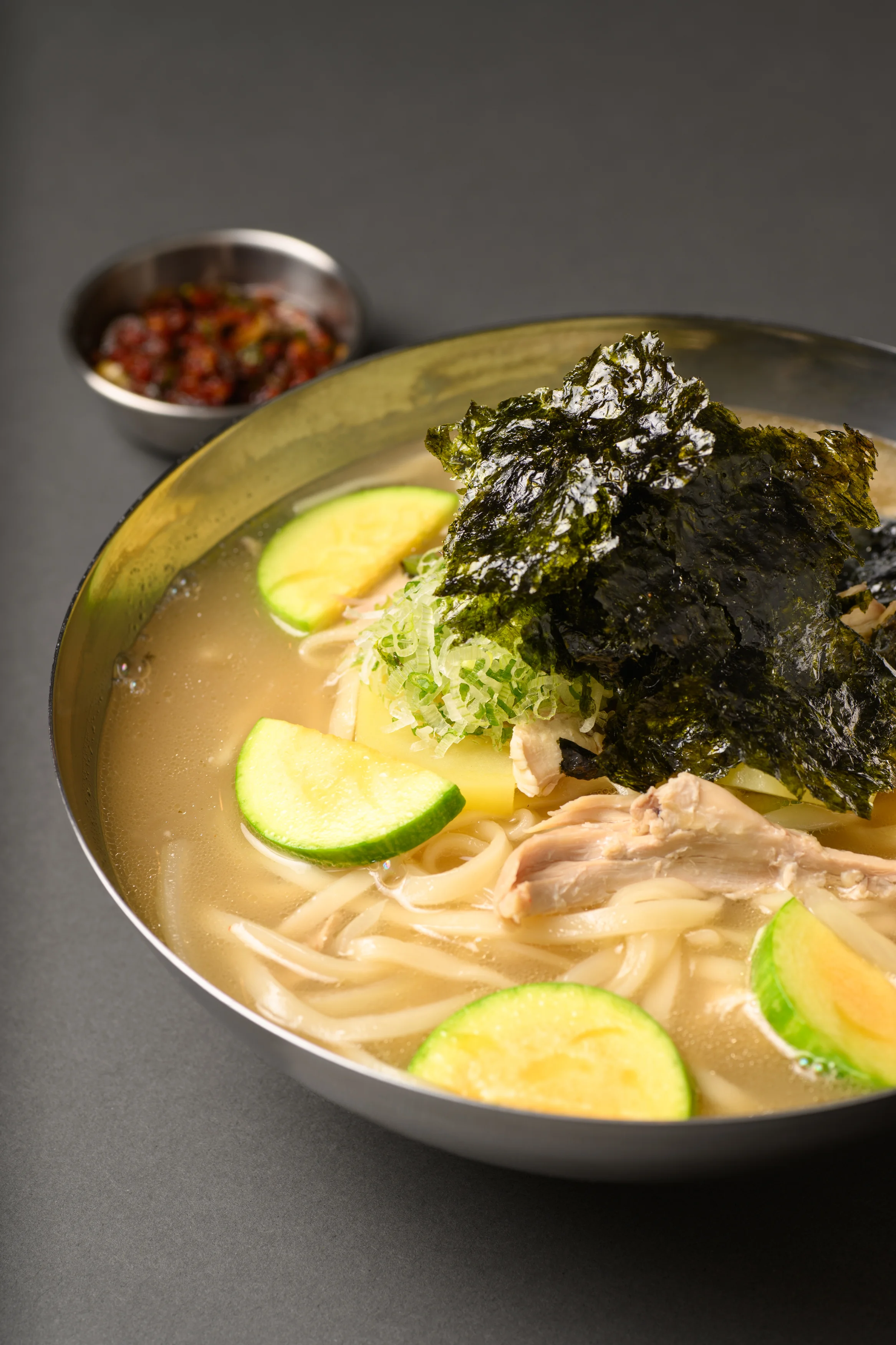Japanese ramen with chicken and seaweed in a rich broth