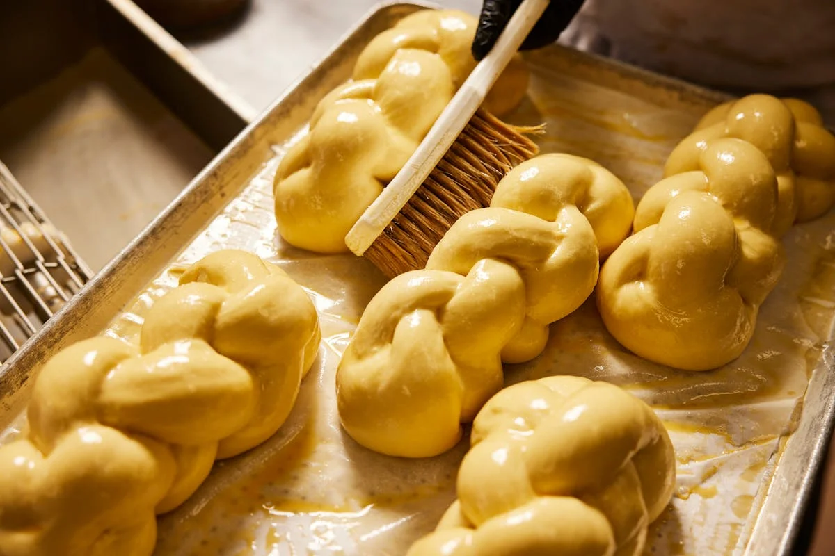Freshly braided challah bread ready for baking