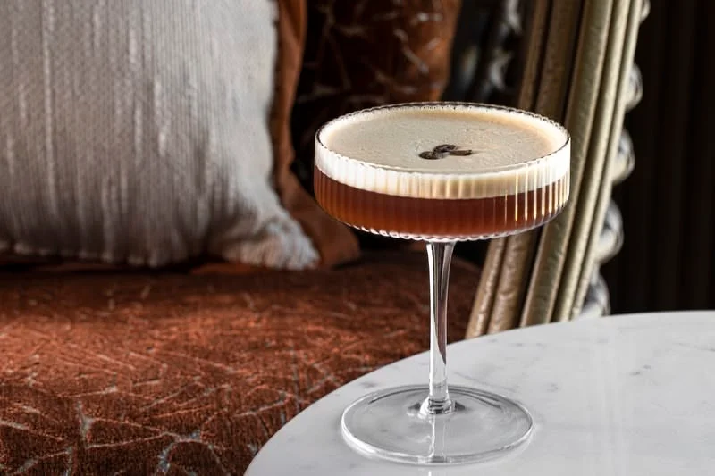Elegant espresso martini cocktail on a marble table