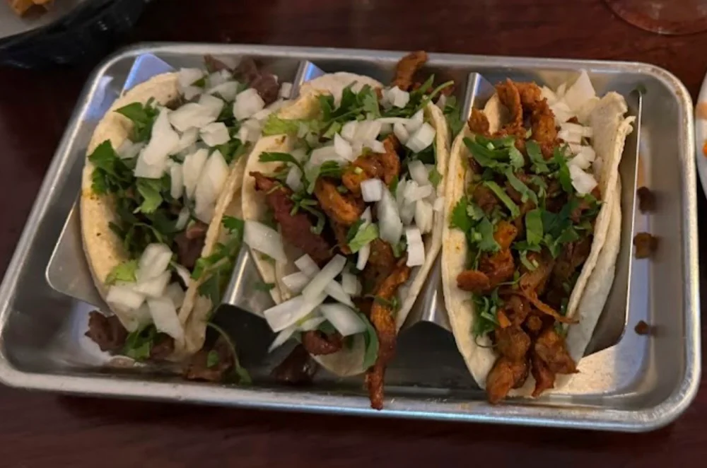 Authentic Mexican street tacos with cilantro and onions