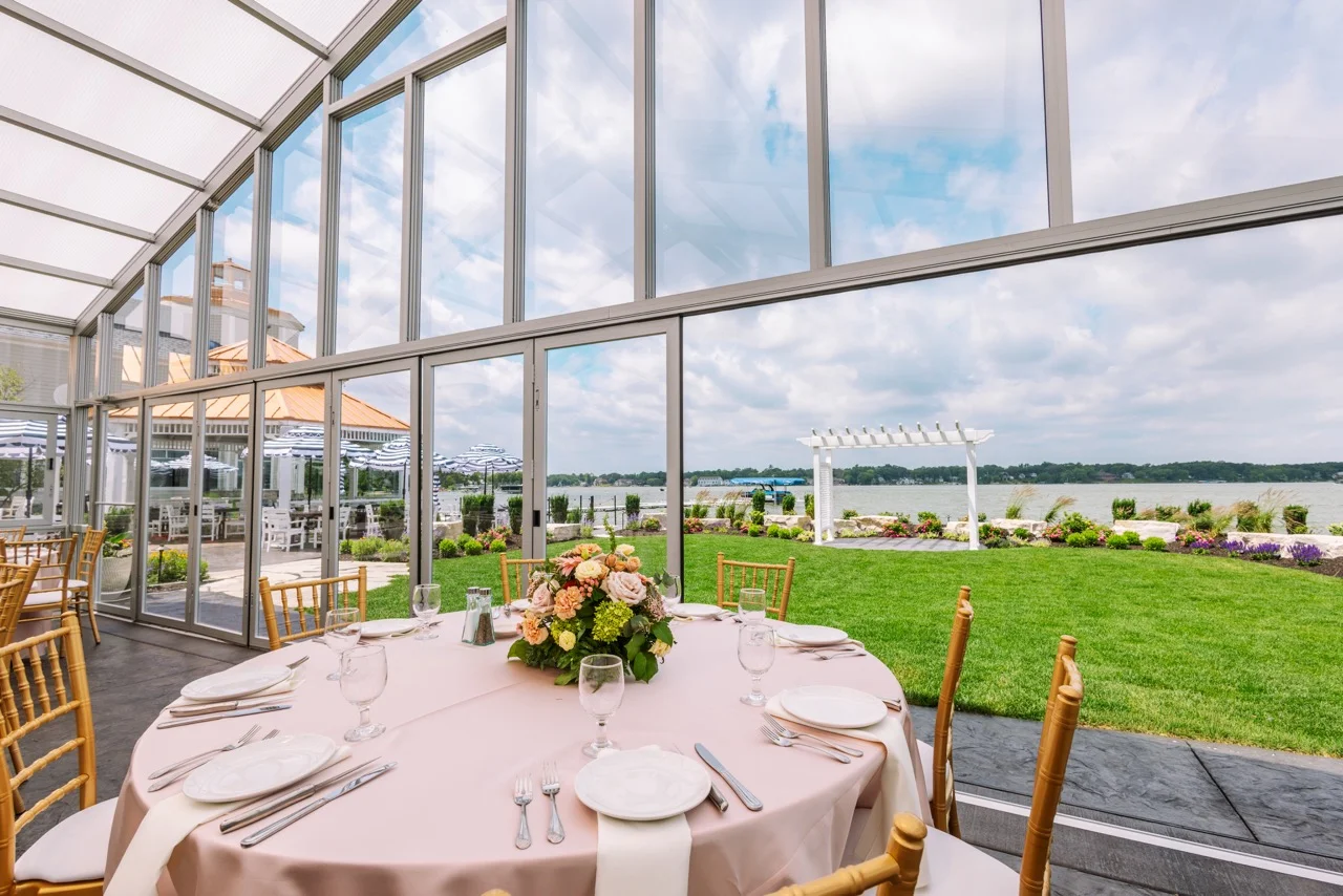 Elegant dining area with lake view and floral centerpiece