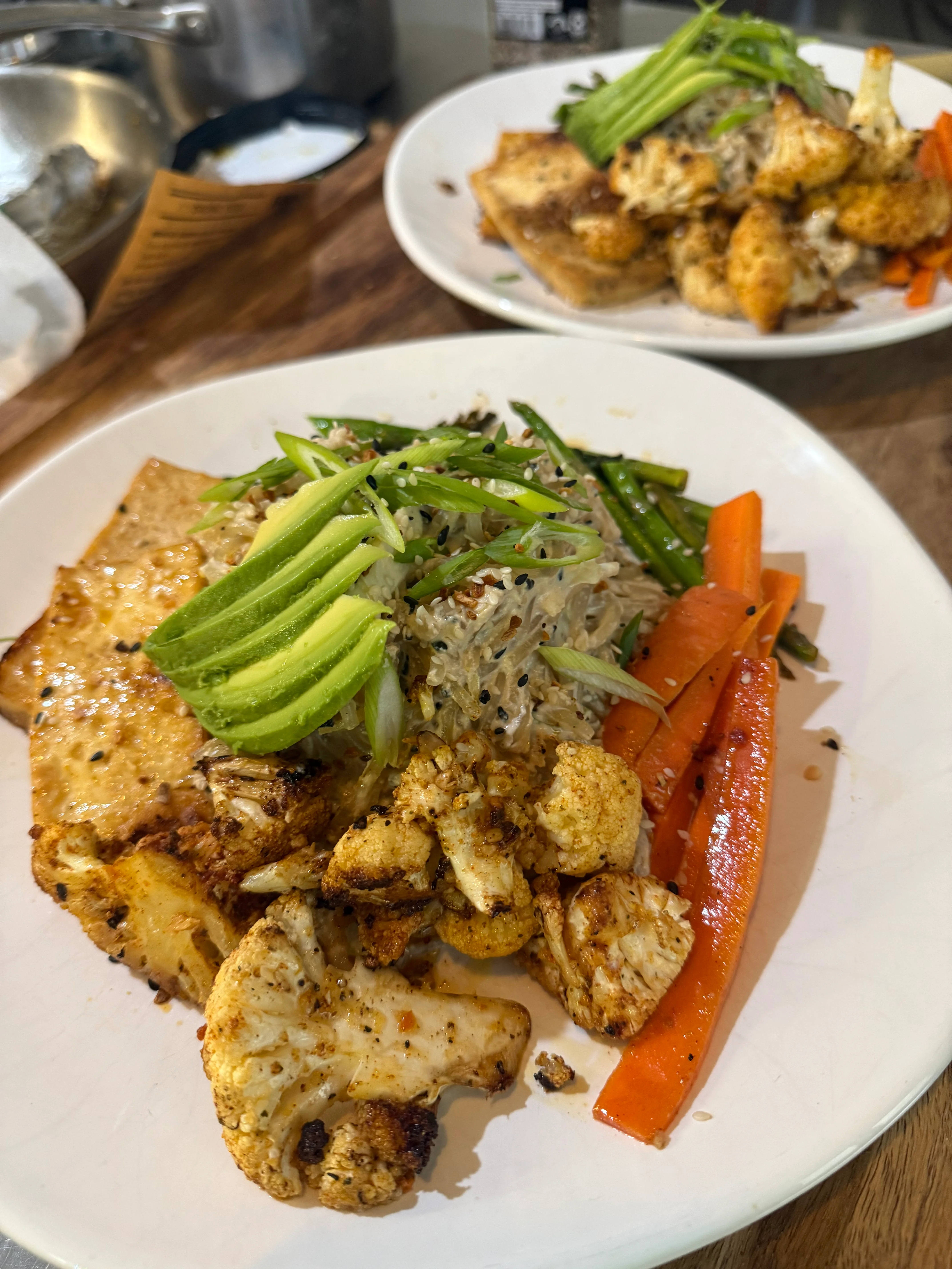 Vegan Asian-inspired rice bowl with tofu and roasted vegetables